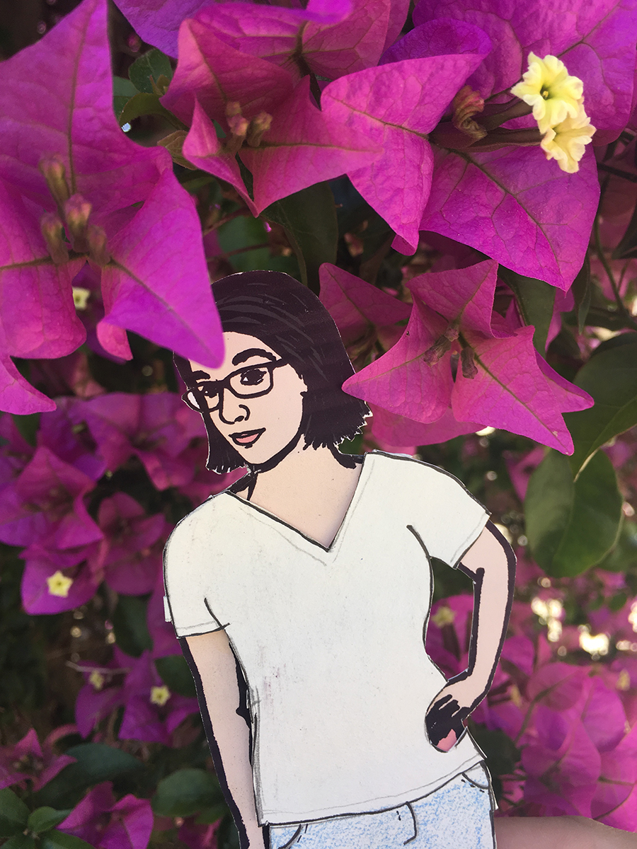 paper doll of the artist with purple flowers
