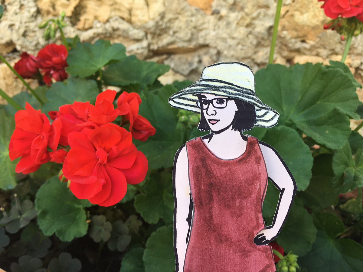 paper doll of the artist with geraniums