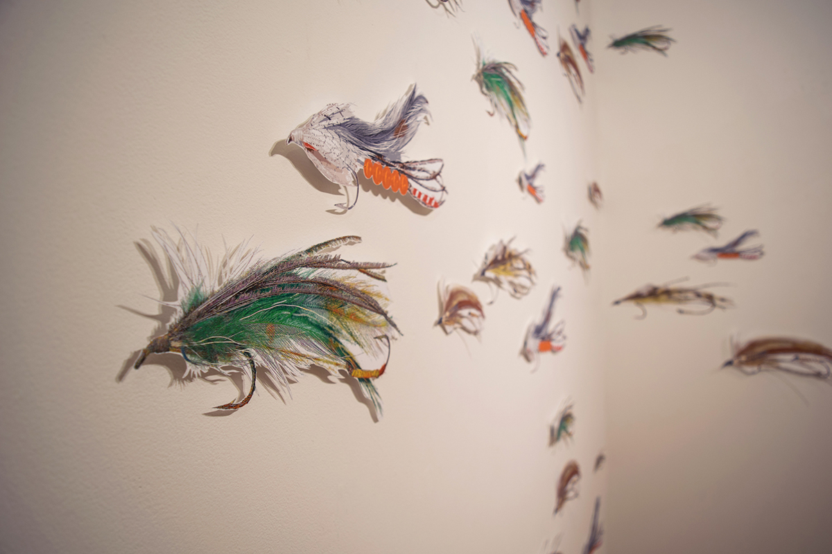 17" long digital illustrations of fishing lures, cut out and mounted on the wall