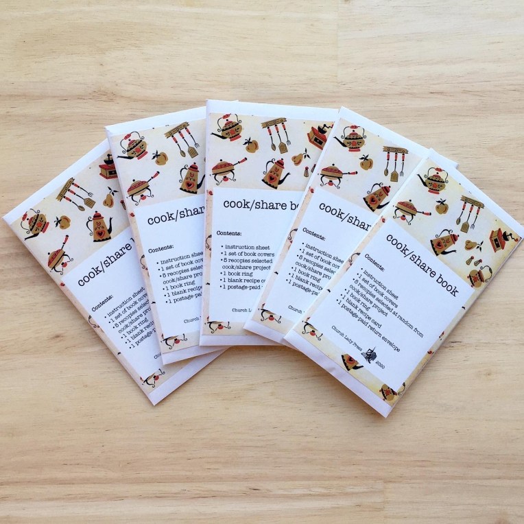 5 cook/share books: each reads "cook/share book. Contents: 1 instruction sheet, 2 covers, 5 recipe cards at random for cook/share projects, 1 book ring, 1 blank recipe card, 1 postage-paid addressed envelope." 