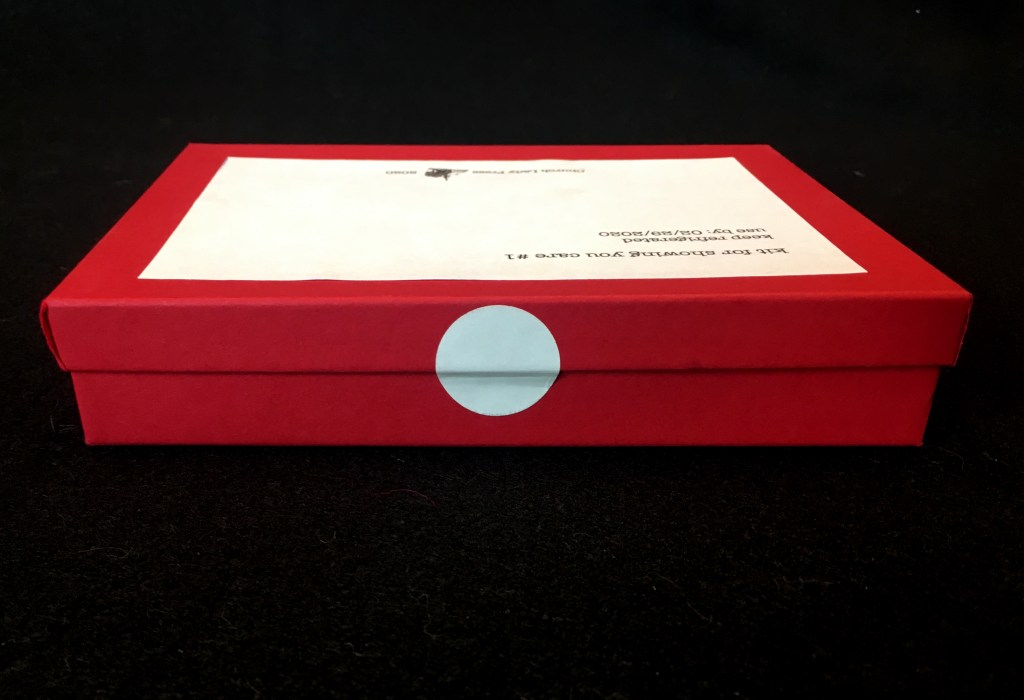 side view of box with round sticker seal
