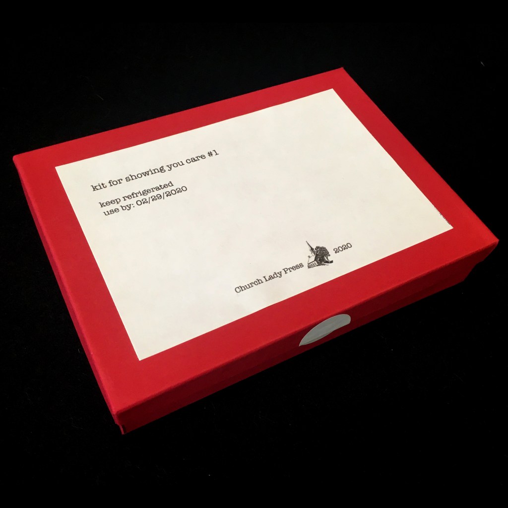 angled view of box which reads "kit for showing you care #1. keep refrigerated. use by: 02/29/2020. Church Lady Press. 2020." Link to kit for showing you care #1.